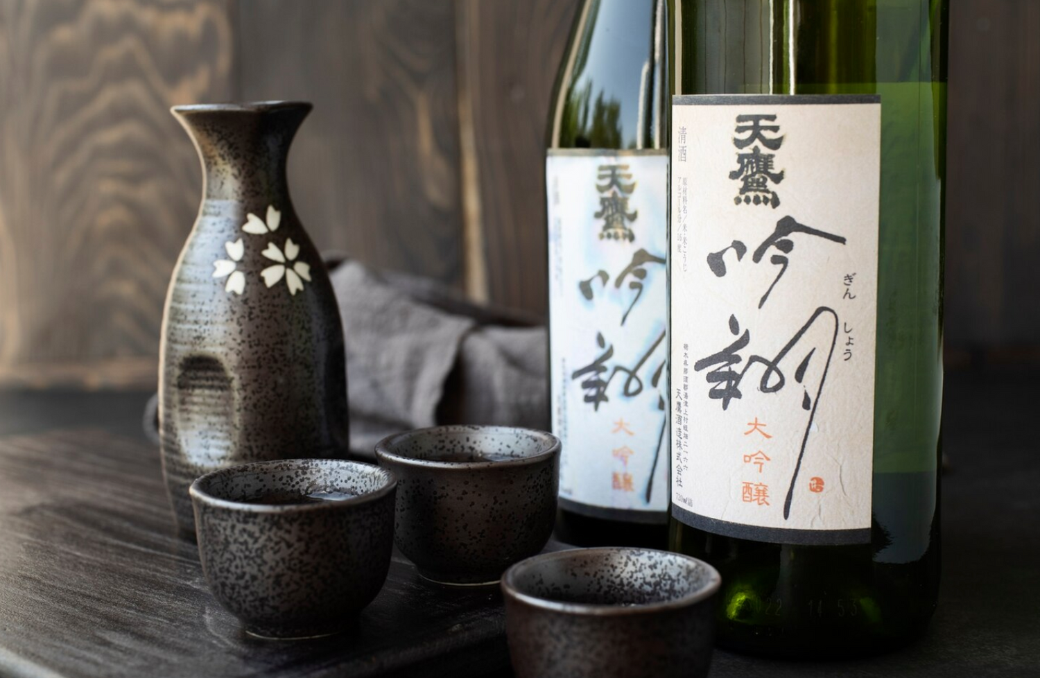 Sake bottles and dark cups